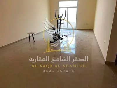 Two bedroom apartment with a living room for rent in Al Qulayaa Sharjah Features spacious interiors a balcony and central air conditioning ready