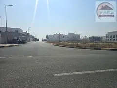 Land for sale in the Howshi area, Sharjah; a corner plot available for freehold ownership by Arabs.