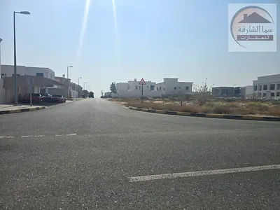 Land for sale in the Howshi area, Sharjah; a corner plot available for freehold ownership by Arabs.