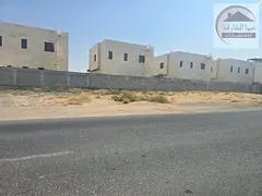 Land for sale in Sharjah, Rawdat Al Qart area; freehold ownership for Arabs; located on Street 97.