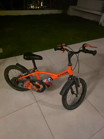 Orange children's 14-inch bicycle with training wheels (4-6 years age)