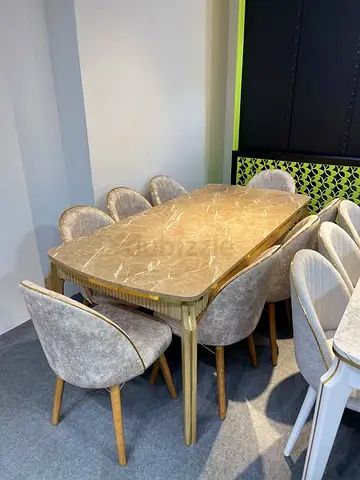 Marble-top dining table with 8 upholstered chairs - good condition