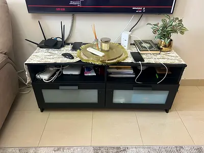 A TV table and a coffee table for a throw away price 300 aed only.
