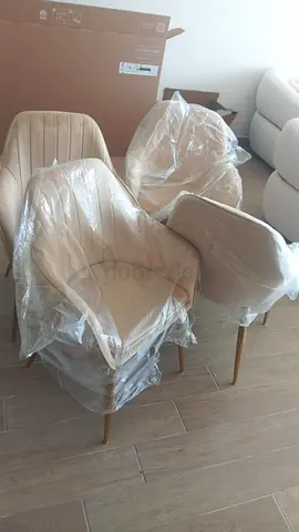 Set of 4 beige upholstered dining chairs with brass legs - like new