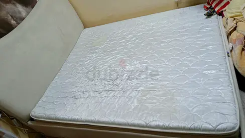 Used double mattress in fair condition with slight stains