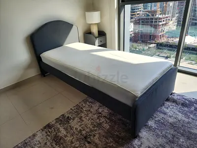 Single grey upholstered bed frame with mattress - good condition
