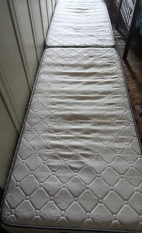 Two single mattresses - used, good for guest room or rental