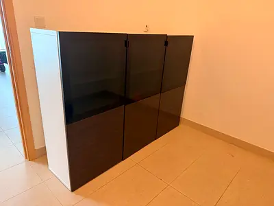 Modern large storage cabinet with black glass doors - good condition