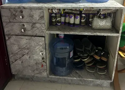 Marble-effect storage cabinet with drawers and open shelves