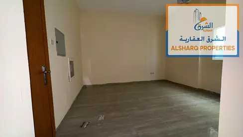 Spacious studio in Al Jurf 3, Ajman, featuring a large comfortable space, a separate kitchen, and central air conditioning and cooling. The studio is