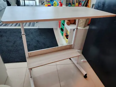 Height-adjustable compact study table with wheeled base