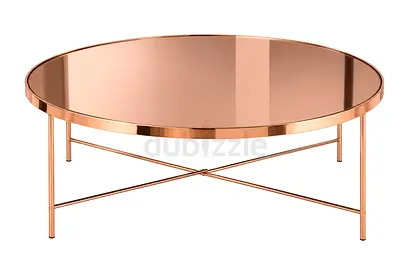 Round rose-gold metal coffee table with mirrored top