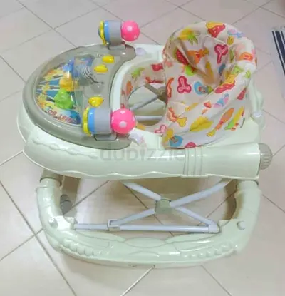 Baby walker with activity tray and padded seat - good condition