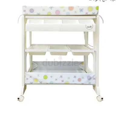 Baby changing table with storage shelves and detachable tubs