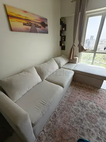 Light beige L-shaped fabric sofa with chaise - good condition