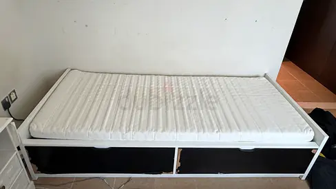 Single bed frame with under-bed storage and mattress.