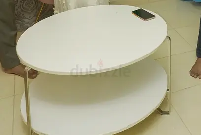 Round two-tier white coffee table with metal legs - good condition