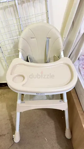 Used beige baby high chair with removable tray
