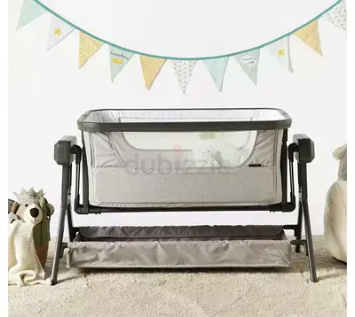 Portable bedside bassinet / co-sleeper - grey, with storage shelf