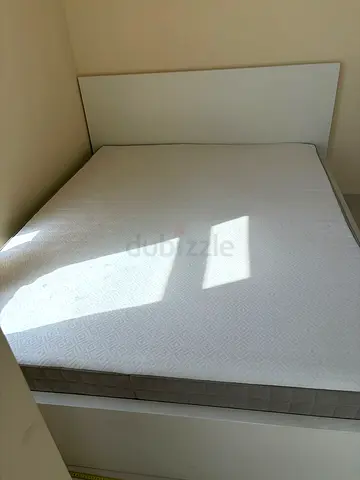 White double bed frame with mattress and underneath storage - good condition
