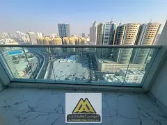 Two bedrooms and a living room / Prime space / Balcony with an open view / In Al Waha Towers Al Rash