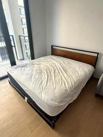 Queen size wooden and metal bed frame with headboard - excellent condition. Mattress included