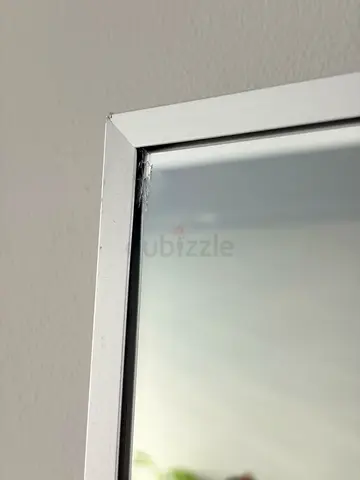 Wall mirror with white aluminum frame — small/minor corner wear