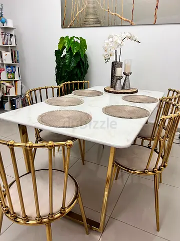 Marble-top dining table with gold spindle chairs (160*90cms) original price aed 4,150