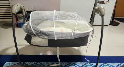 Portable baby bassinet with mosquito net and gentle rocker