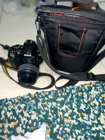 Nikon D3100 camera with lens and carrying bag - good condition