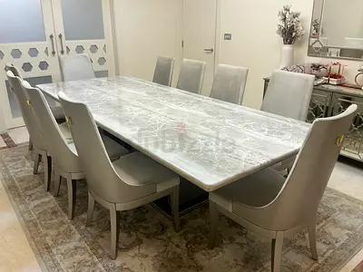 A 10 seater table with great quality marble veneer.