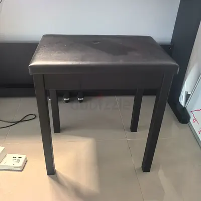 Simple black piano/bench stool with padded seat