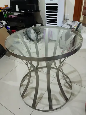 Round glass top side table with stainless steel base