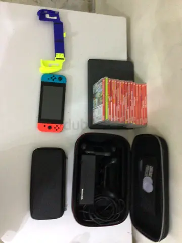 Nintendo Switch console with 10+ games, two cases and controllers,working fine 256gb and 128gb sd
