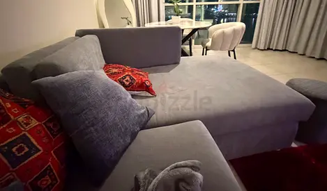 Light grey L-shaped sectional sofa with chaise, good condition
