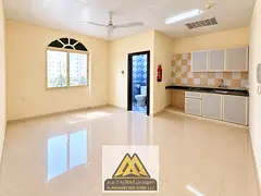 Ground-floor studio for annual rent in Al Nuaimiya 1, Ajman | Unfurnished (no AC) | Maintenance cove