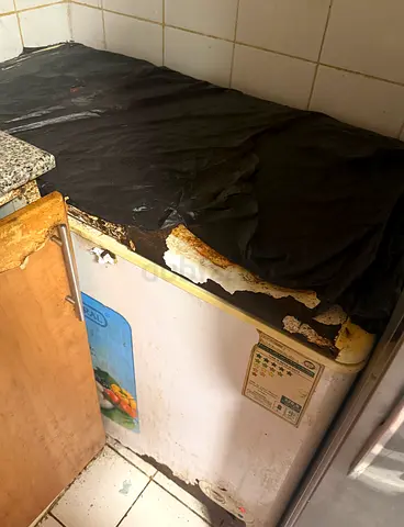 Small chest freezer with worn top — used, needs repair
