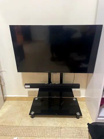 40-55 inch LED TV on black glass TV stand - good condition (no remote)