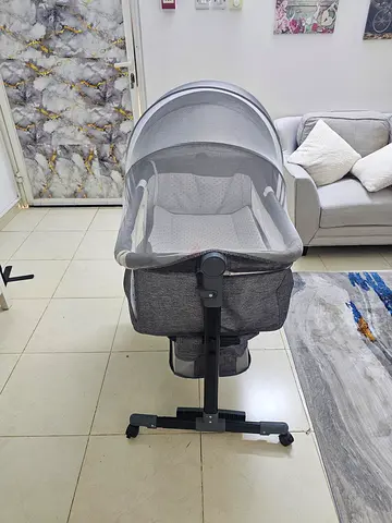 Grey baby bassinet/rocker with canopy - gently used