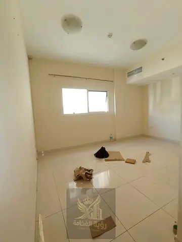 One bedroom apartment with living room for annual rent in Al Majaz 3 Al Qasba, directly next to Al Qasba Lake. Includes bedroom, living room, kitchen,