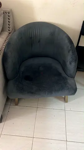 Used curved velvet accent chair - dark grey