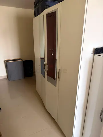 White 4 door wardrobe with mirror and lock — good condition