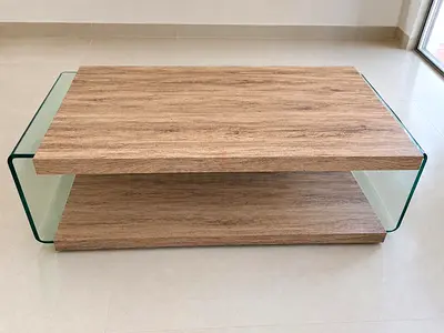 Modern glass-sided coffee table with wood finish
