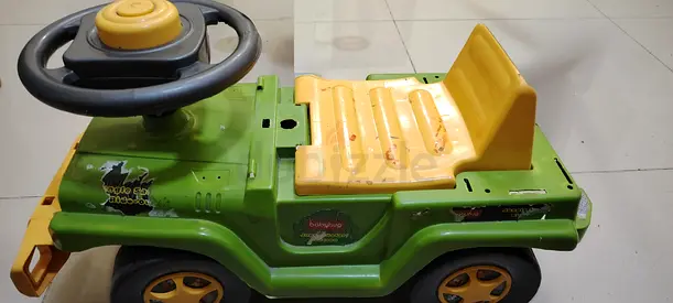 Green ride-on toy car for toddlers - push/walk-behind vehicle