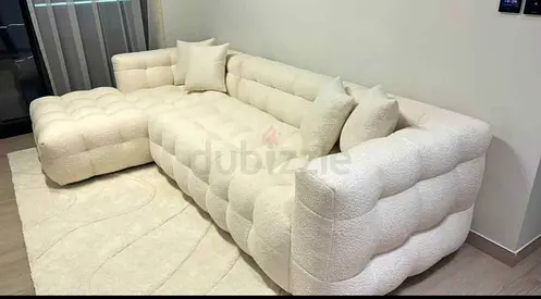 Cream tufted L-shaped sectional sofa with chaise - modern boucle upholstery