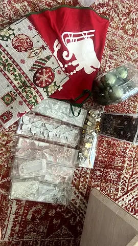 Box of Christmas ornaments, stockings and decorative hangings - used