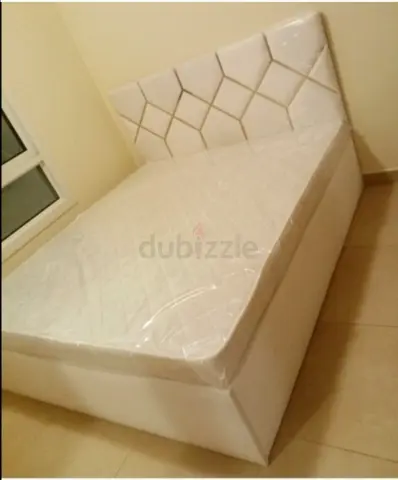 Queen size white upholstered bed with storage - like new