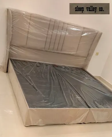 Queen size upholstered bed frame with padded headboard