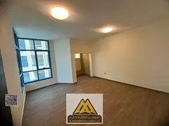 2BR in Al Khor Towers, 3 baths, 2 balconies, maid room, central AC, AED 45,007 in 6 payments.