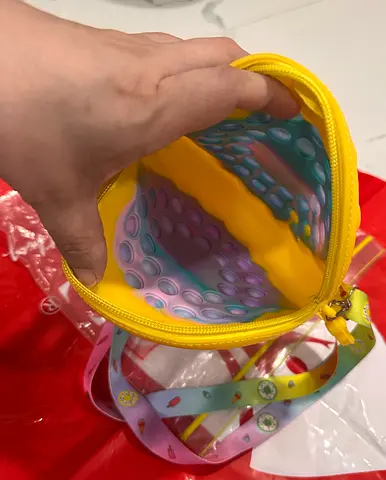 Unisex Kids round silicone pop-it pouch with strap — like new